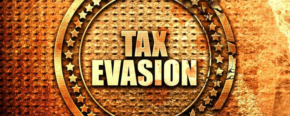 Husband Pleads Guilty to Tax Evasion - Wife's Charges Dropped